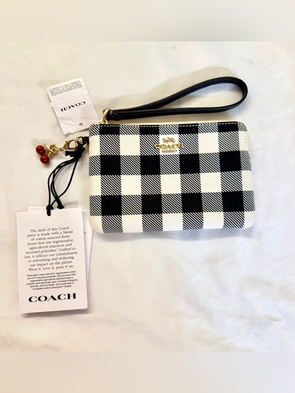 Coach Black & White Check Wristlet with Cherry Charm